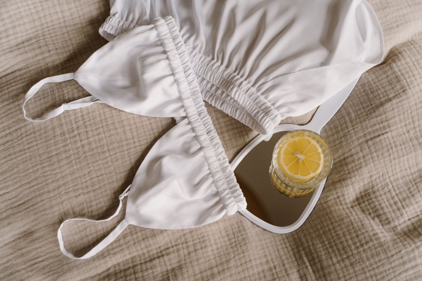 Clean white underwear and a hand mirror for an intimate-health guide